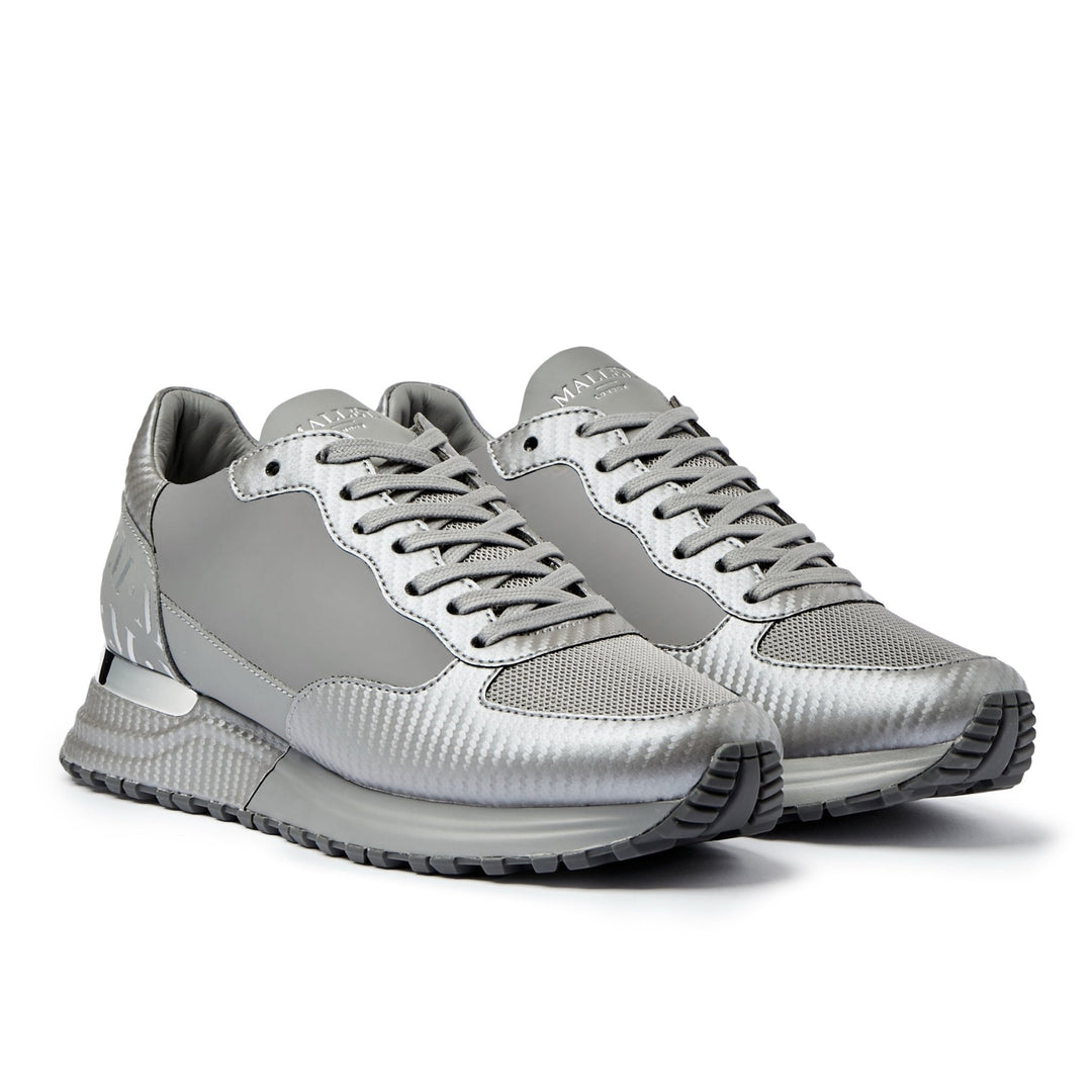 Pair of grey and silver MALLET sneakers on a white background
